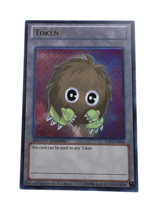 Yu-Gi-Oh! Token trading card featuring a fuzzy brown creature with green, spiky hands.