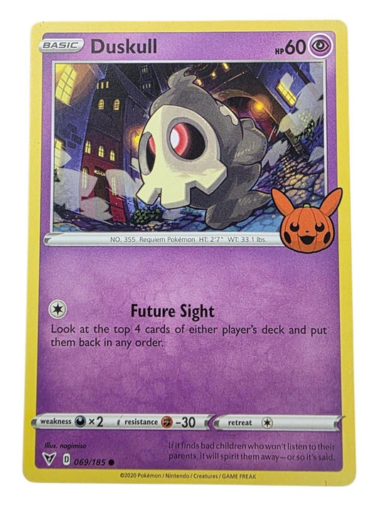 Duskull 069/185 Pokemon card with a spooky town illustration and Pikachu pumpkin stamp.