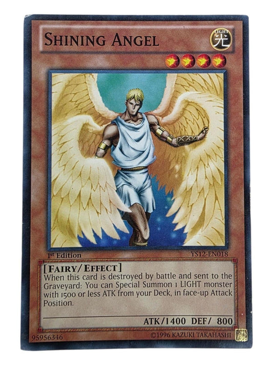 Shining Angel 1st Edition Yu-Gi-Oh! card showing a winged angelic figure.