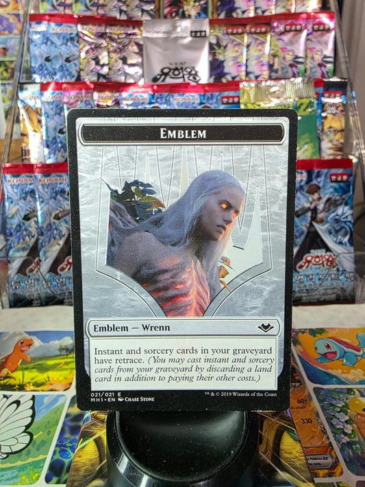 Foil Wrenn and Six Emblem trading card with white hair art and game text against a display background.