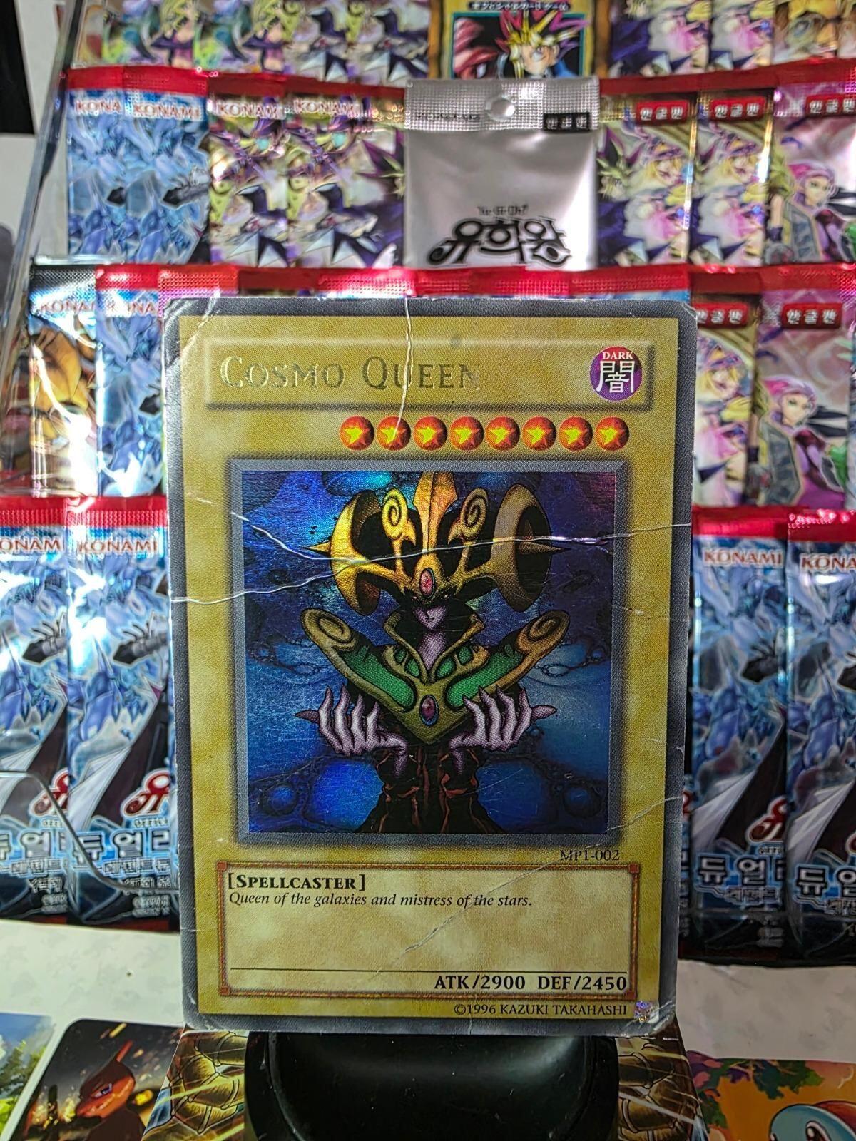 Cosmo Queen Ultra Rare Yu-Gi-Oh! promotional card MP1-002 with creases.