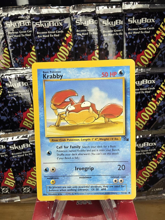 Vintage Krabby trading card with a yellow border and blue frame, featuring the red crab Pokémon.