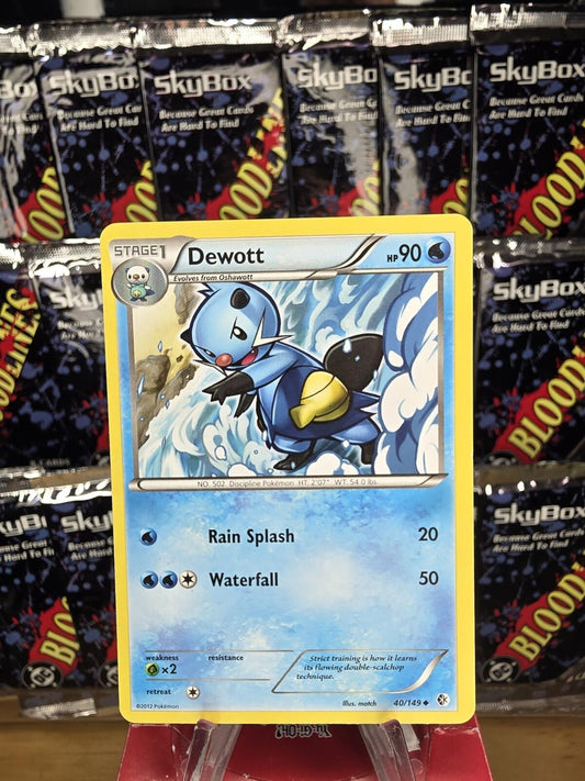 Pokémon Dewott trading card with blue, white, and yellow details against a background of SkyBox card packs.