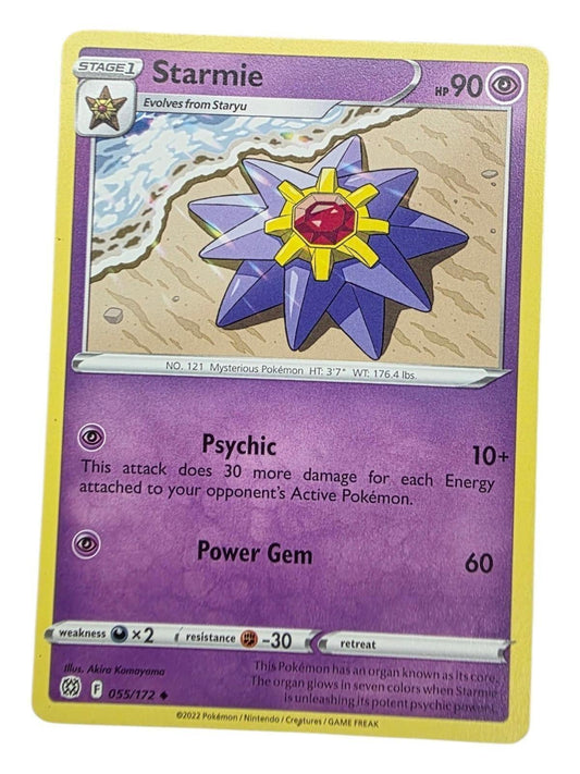 Starmie Uncommon Pokémon card from Brilliant Stars, showing the purple starfish on a sandy beach.