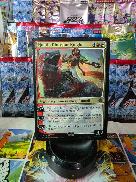 Huatli, Dinosaur Knight foil Magic card featuring art of a warrior riding a dinosaur.