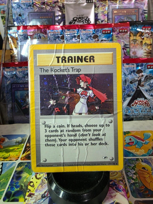 The Rocket's Trap Trainer card from Gym Heroes in a protective sleeve.